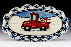 red-truck-in-snow-scalloped-oval